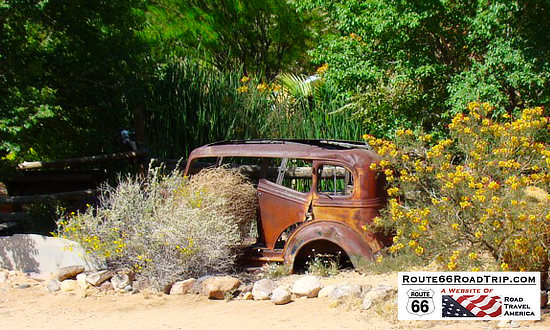Rusted car resting in the desert at the Hackberry General Store in Arizona on Route 66