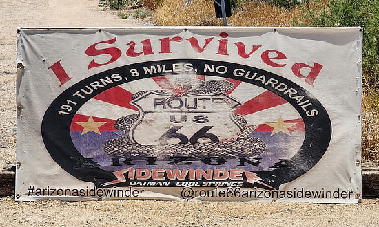 Sign in Oatman, Arizona: I survived the Arizona Sidewinder: 191 turns, 8 miles of Historic Route 66, no guardrails!