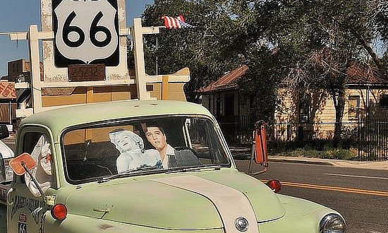 Elvis and Marilyn in the old green truck on Route 66 in Seligman, Arizona