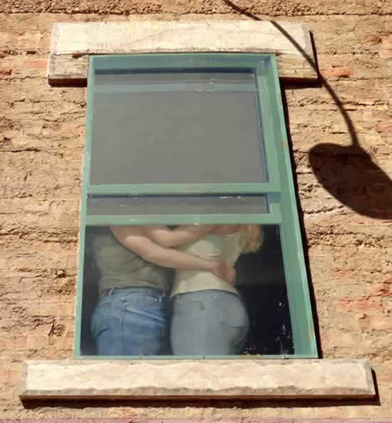Lovers in the second floor window at the Standin on the Corner Park in Winslow Arizona