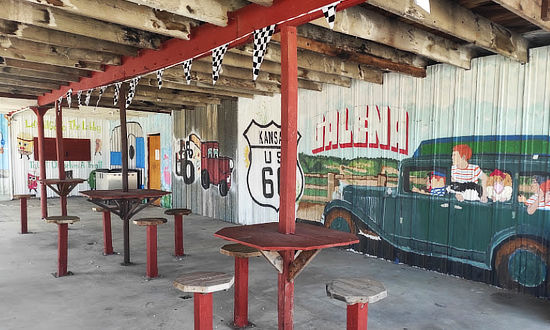 Inside view of tables and the mural at Luigi's Pit Stop in Galena, Kansas