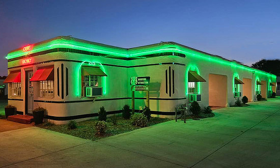 Neon burning brightly at night, at the Historic Boots Court, Route 66 Carthage, Missouri