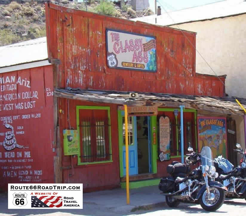 Oatman Hotel Sign Postcard Arizona Flags Stores etc Motorcycles on Route 66 