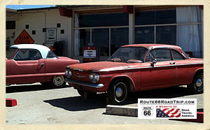 The red Corvair and Metropolitan on Route 66 in Arizona