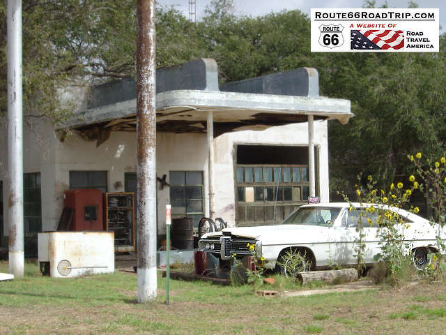 Old gas station and white Pontiac in Glenrio, Texas